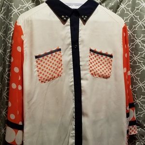 White, orange/red and navy blouse